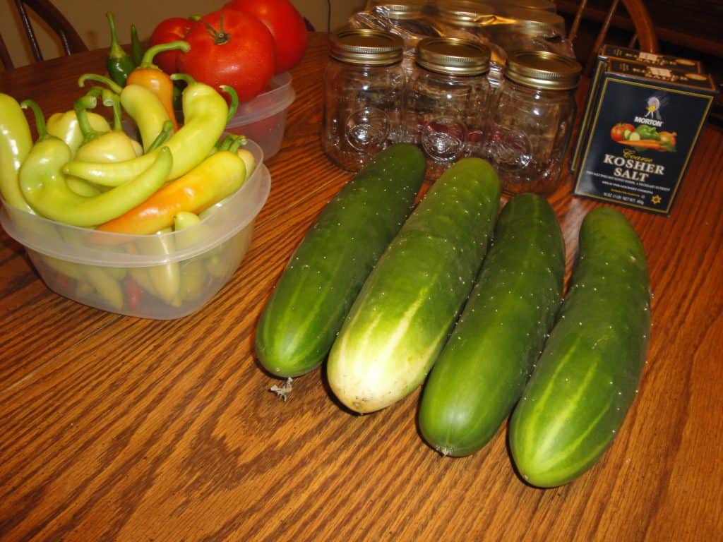 Cut cucumbers with banana peppers.