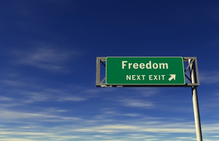 Sign that says, \"Freedom, next exit.\"