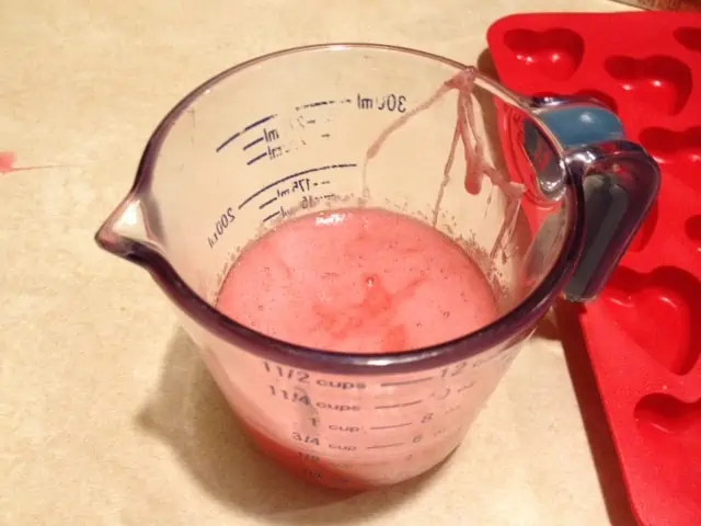 Jello mixture in measuring cup.