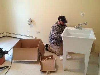 Installing a laundry tub.