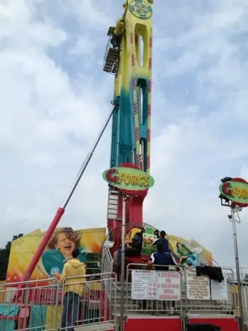 A group of people riding on a carnival ride.