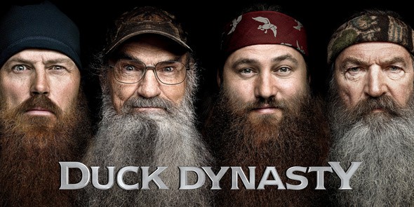 Jase Robertson, Si Robertson, Willie Robertson, Phil Robertson are posing for a picture. The men of Duck Dynasty. 