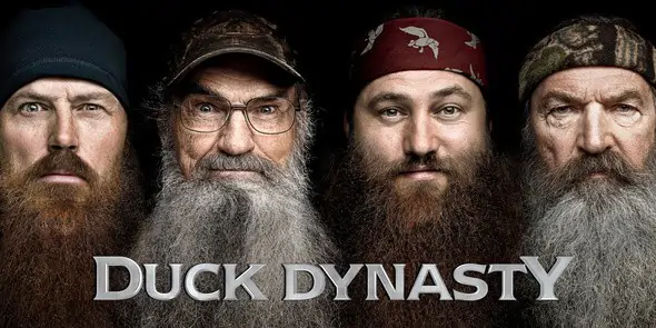 Jase Robertson, Si Robertson, Willie Robertson, Phil Robertson are posing for a picture. The men of Duck Dynasty. 