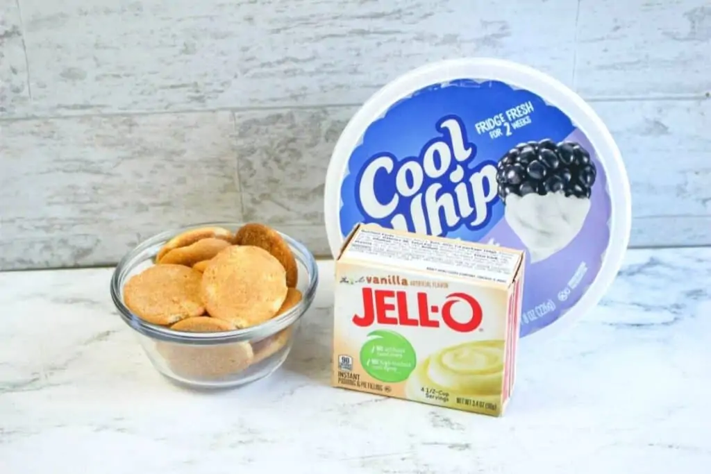 Ingredients for banana cream pie, including Nilla cookies, vanilla jello, and cool whip.