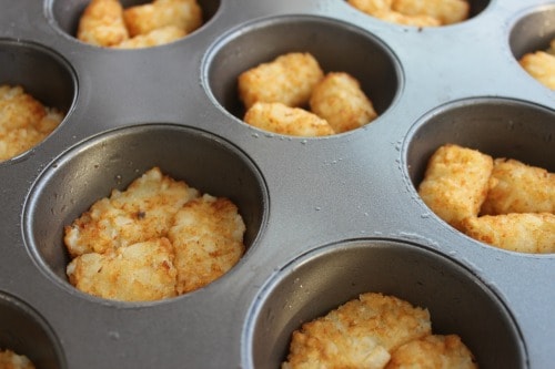 Tater tots in muffin pan for Omelet Breakfast Bites Recipe