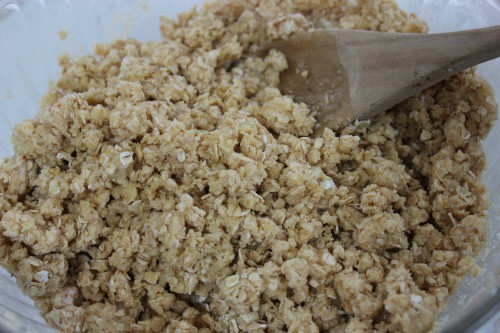 Oats and butter mixed together in a bowl.