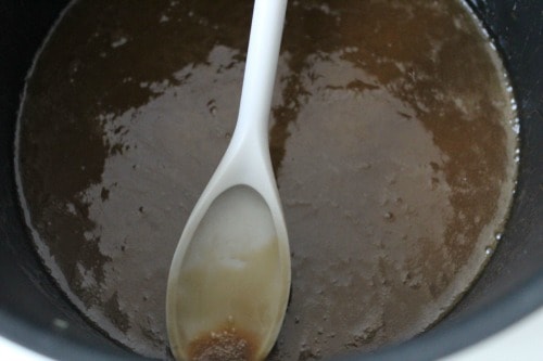 caramel in a pan with a spoon