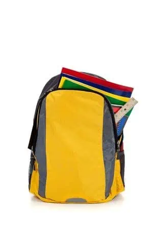 A school backpack full of school supplies.