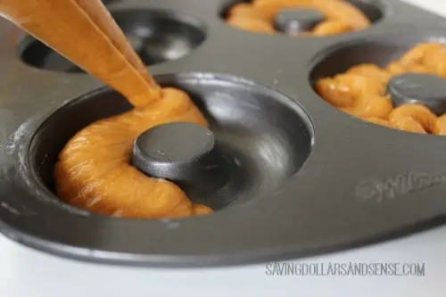 Pumpkin Doughnuts in baking pan.