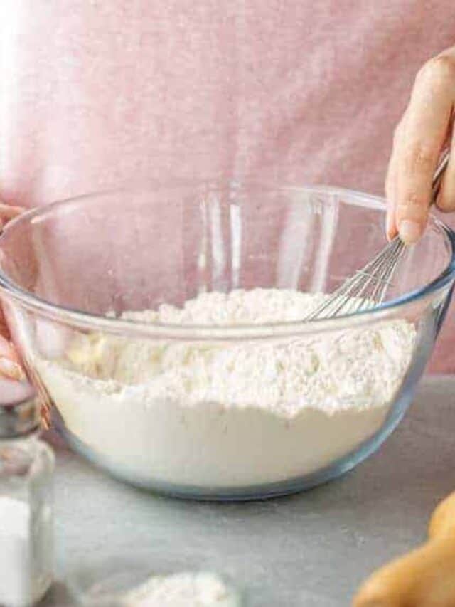 Woman making homemade food in order to save money on groceries with meal planning.