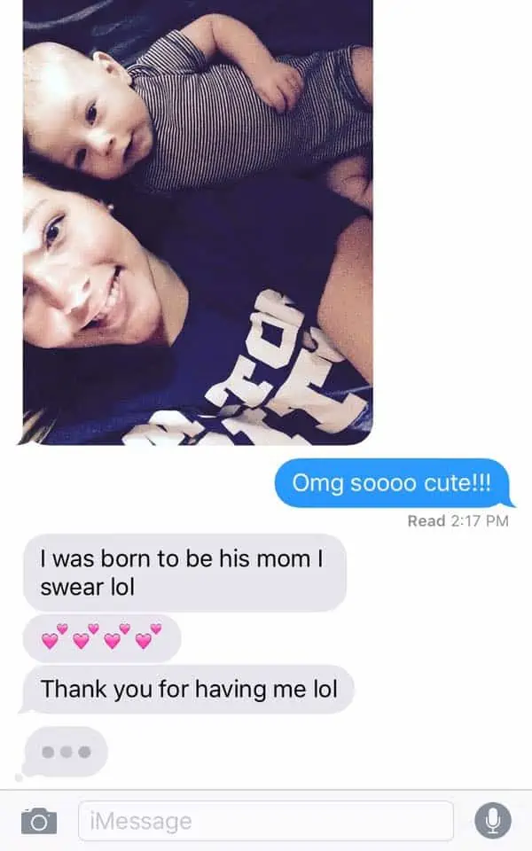 A mom getting a text message from her daughter and grandson. 