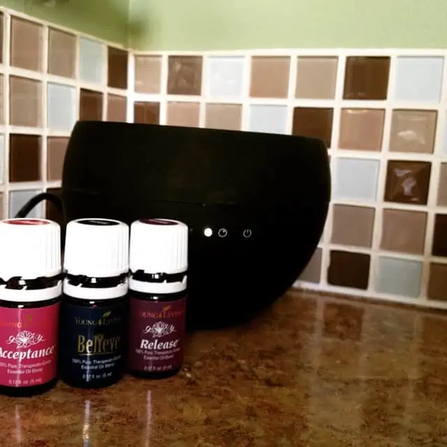 Several bottles of essential oils on the counter top. 