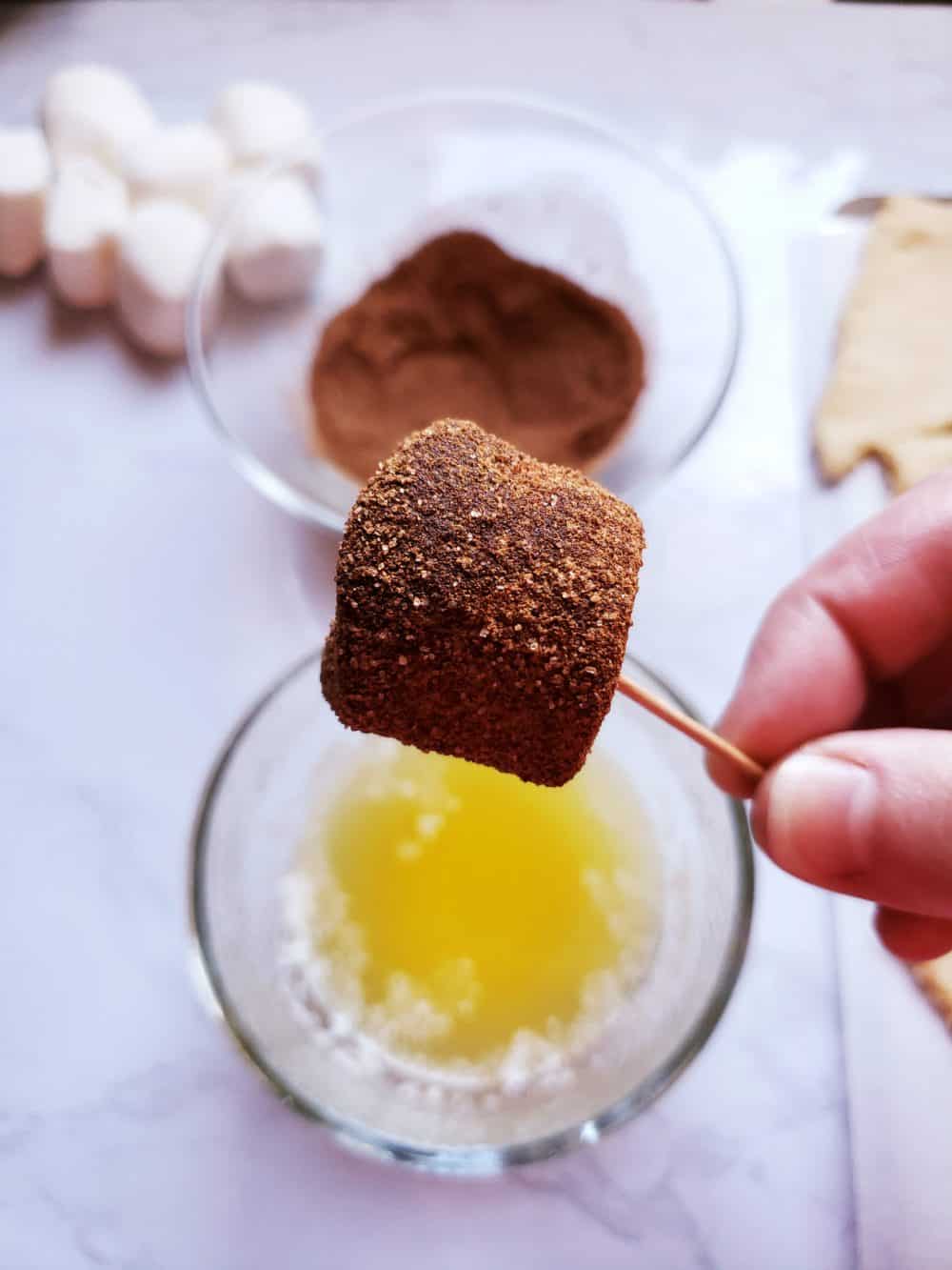 Dip marshmallow in butter and cinnamon/sugar mixture.