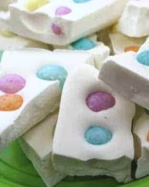 Plateful of white chocolate bark with jelly beans.
