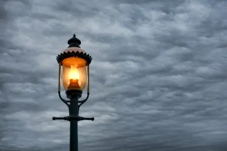 A lamp post on a cloudy day