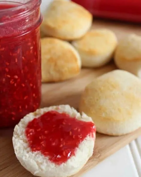 Cooked rolls with No Cook Raspberry Freezer Jam spread on top.