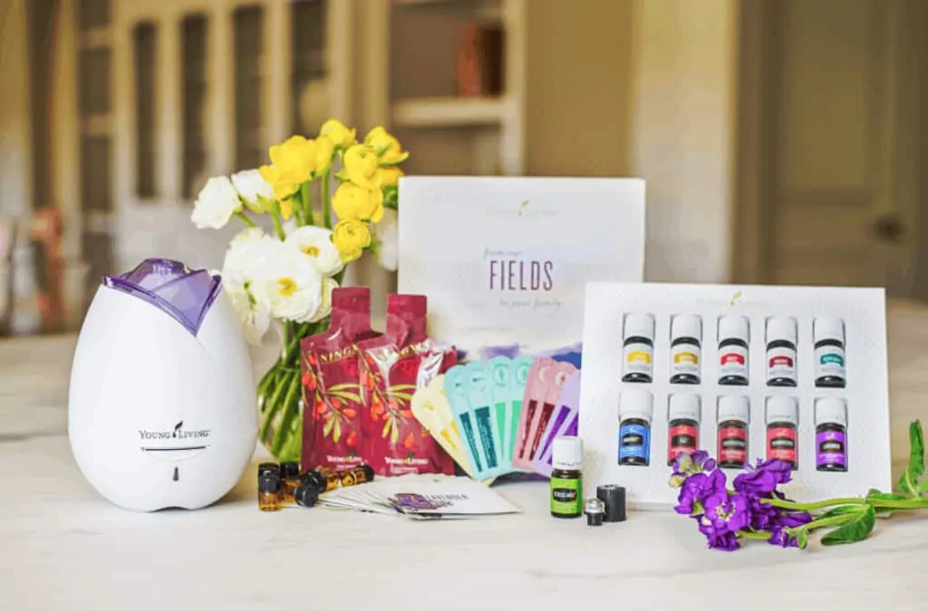 A vase of flowers on a table. Young Living Essential Oils