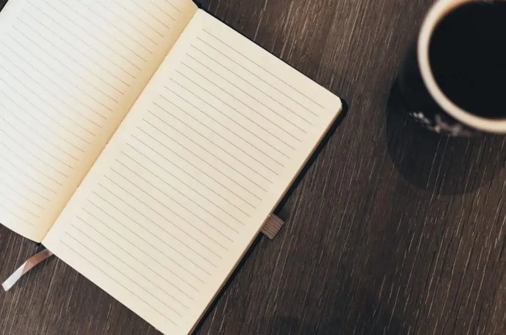 A lined notebook to write thoughts and feelings inside.