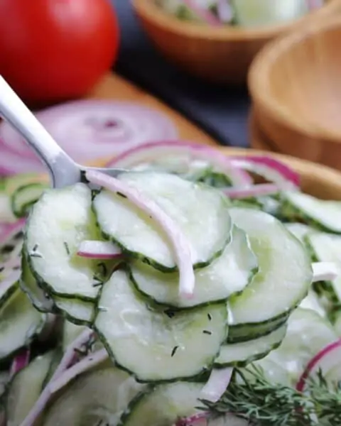 Closeup of creamy cucumber and onion salad.