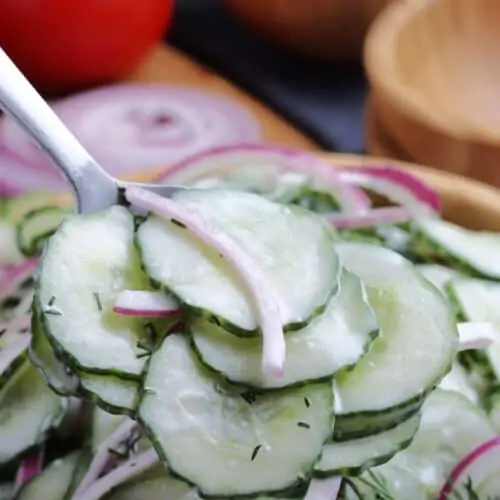 Closeup of creamy cucumber and onion salad.