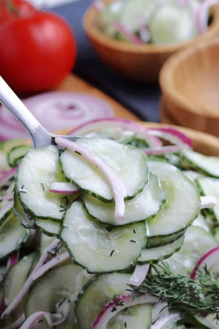 Closeup of creamy cucumber and onion salad.