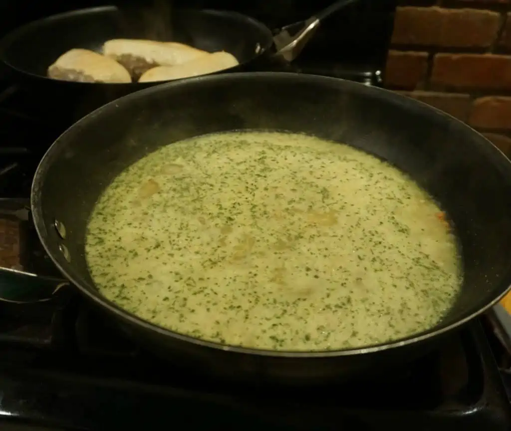 Simmering broth in a pan with children in the next skillet.