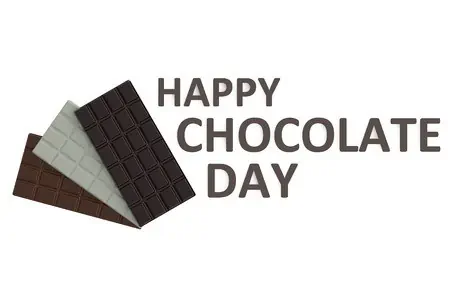 Several different types of chocolate bars with a sign that reads, \"Happy Chocolate Day.\"