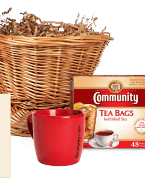A red up with a basket and a Community Tea Bags for individual tea drinks.