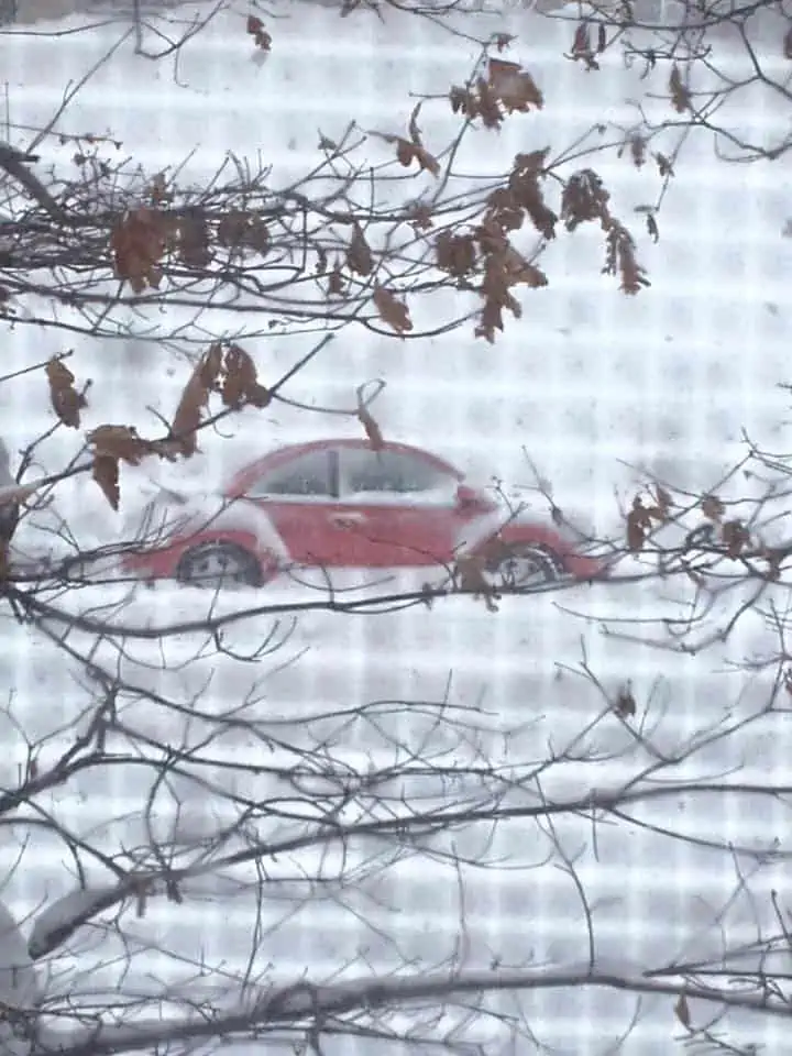A car covered in snow and ice.
