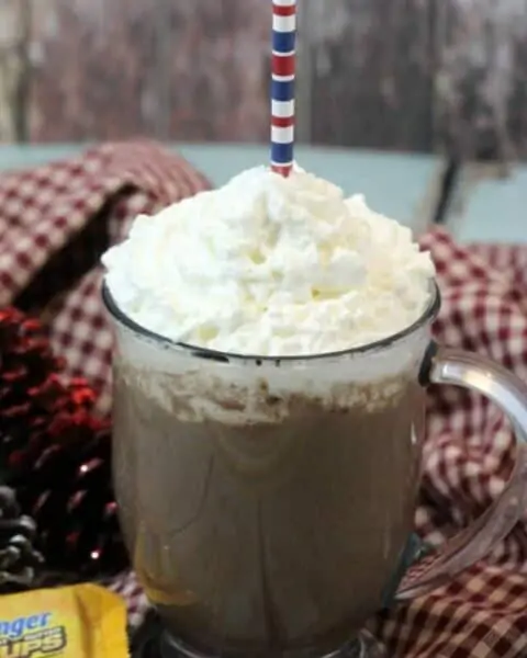 Homemade Butterfinger hot chocolate with whip cream on top.