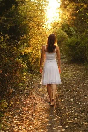 Girl walking down a pathway.