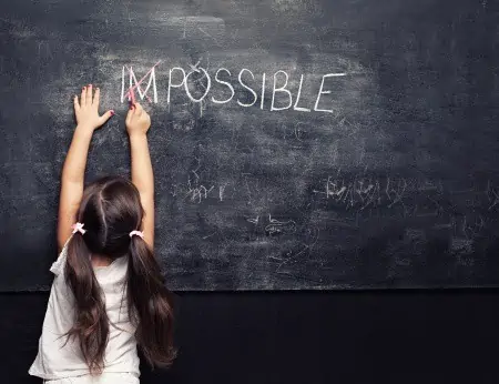 Little girl creating the word \"Possible.\"