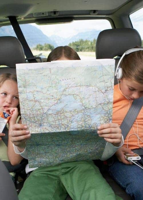 A child reading a map.