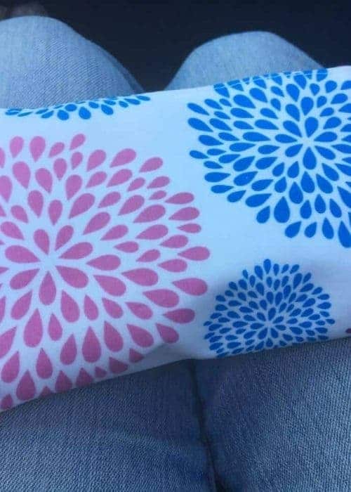 A blue and pink floral case for essential oils.