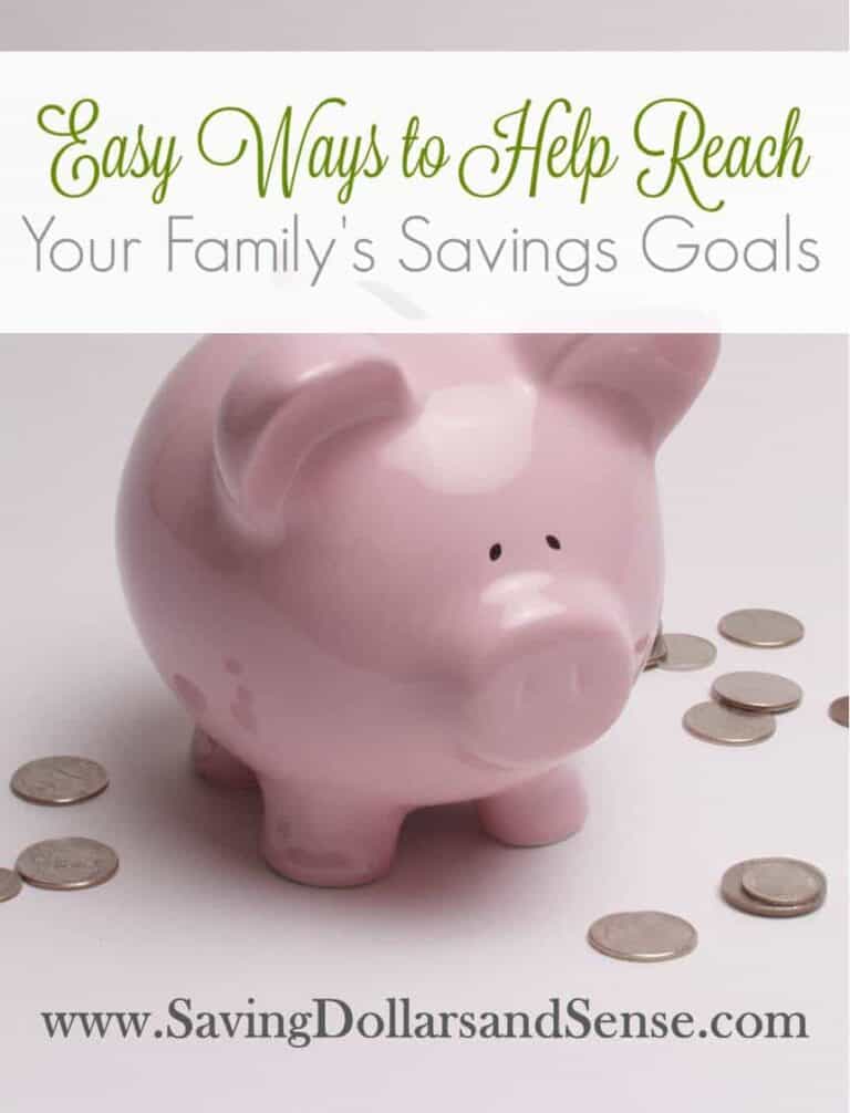 A pink piggy bank with coins surrounding the bank.