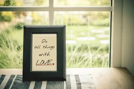 inspirational quote : do all things with love in wooden frame