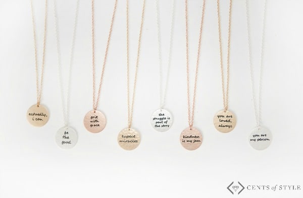 Circle necklace with motivational phrases and quotes.