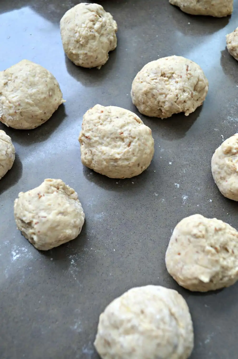 Place dough in small, round balls on a cookie sheet.