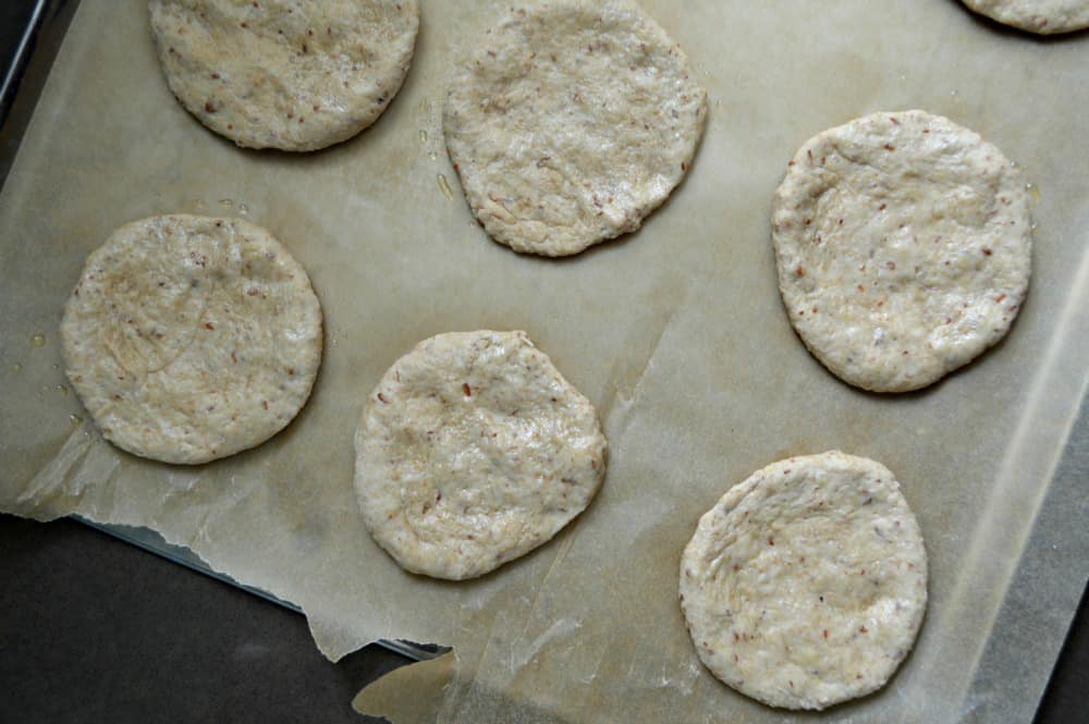 Flatten the dough balls into disc shapes to make the thins.