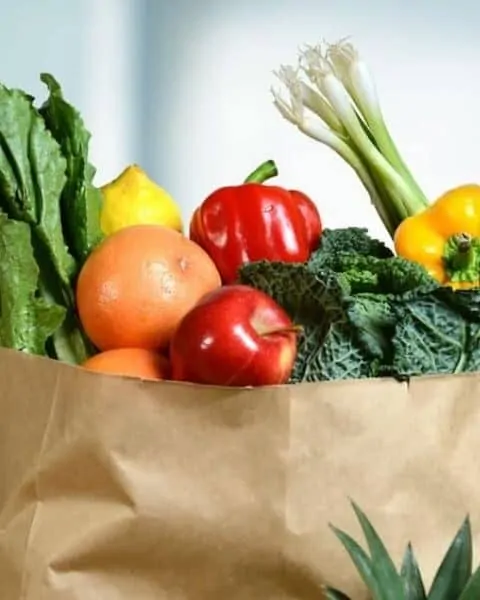 brown grocery bag filled with produce