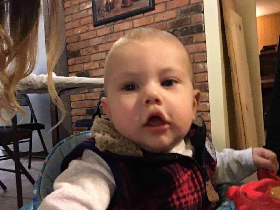 A small child sitting on a chair