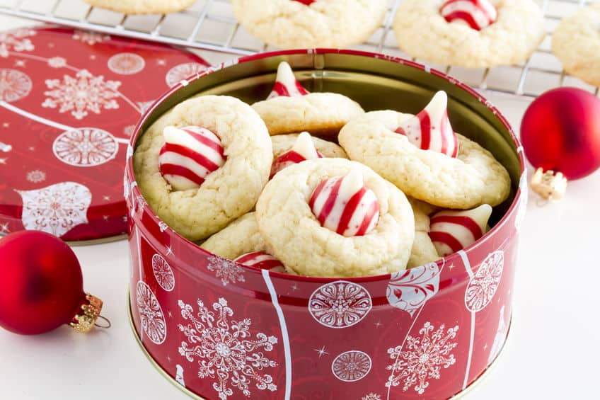 Christmas cookies with KISS chocolate pieces in a snowflake tin.