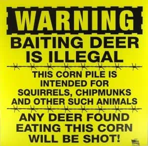 deer hunters Baiting deer is illegal sign.
