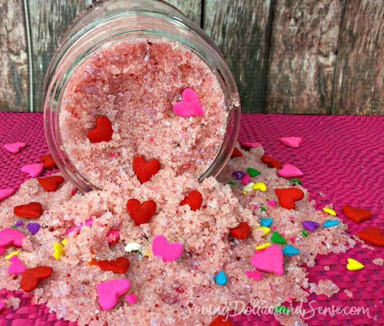 Strawberry sparkle sugar scrub poured over a table top.