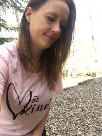 Kristie wearing pink female shirt with saying \"Be Kind\".