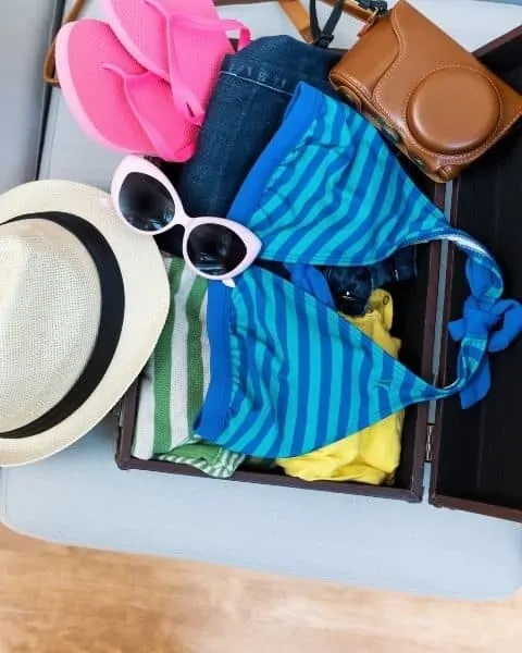 beach essentials and accessories in a bag