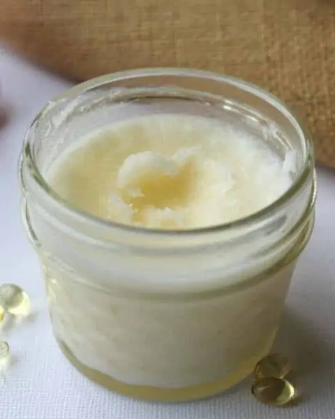 A small mason jar with cream inside.