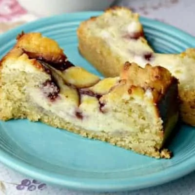 A piece of cake on a plate, Raspberry Cheesecake Loaf