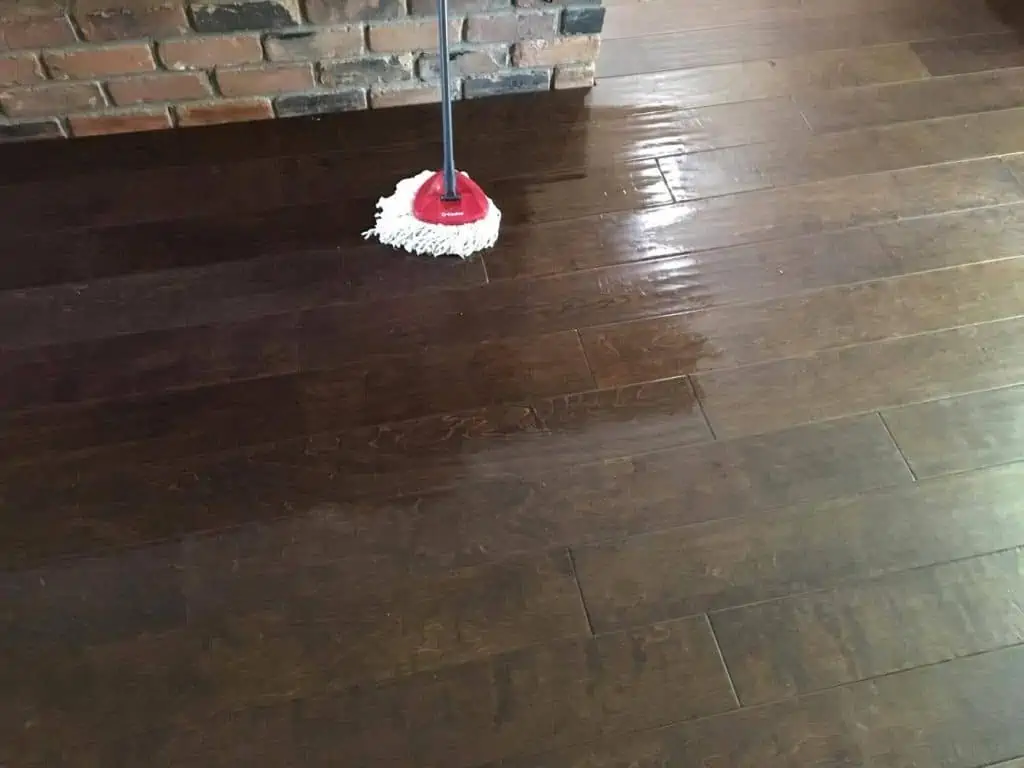 O-cedar easy wring spin mop cleaning the wooden floor.