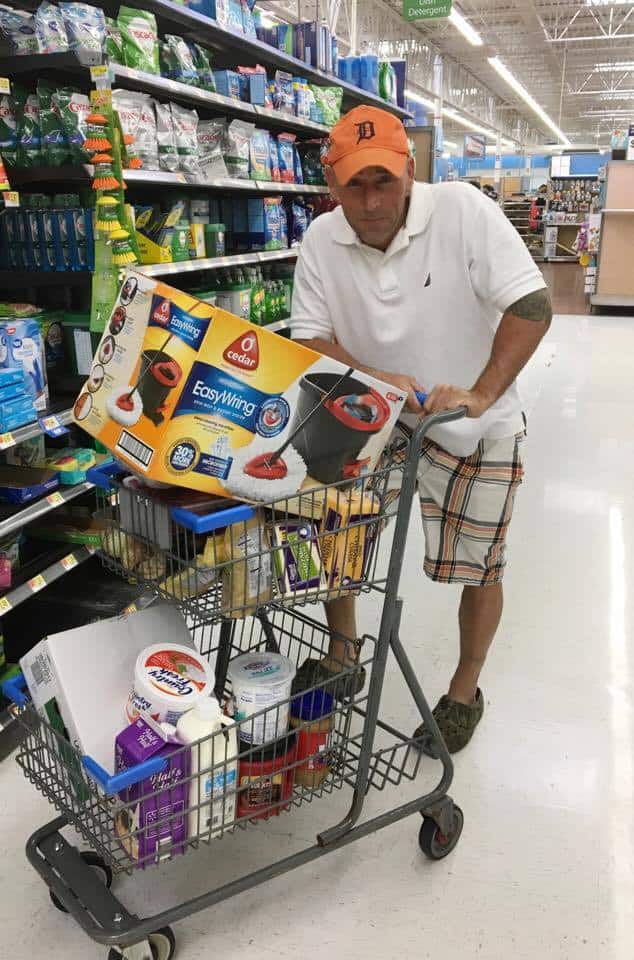 O-cedar easy wring spin mop in a shopping cart.